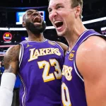 Luka Doncic celebration 60 points Lakers vs Heat NBA mars 2026