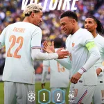 Joueurs de l'équipe de France célèbrent la victoire 2-1 contre le Brésil à Boston